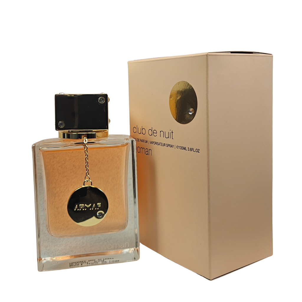 Club de Nuit Woman by Armaf 105 ml perfume bottle next to the box on white background