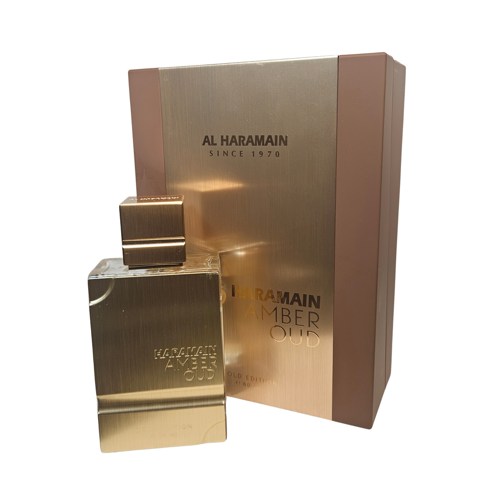 Gold Al Haramain Amber Oud perfume bottle and packaging on a white background